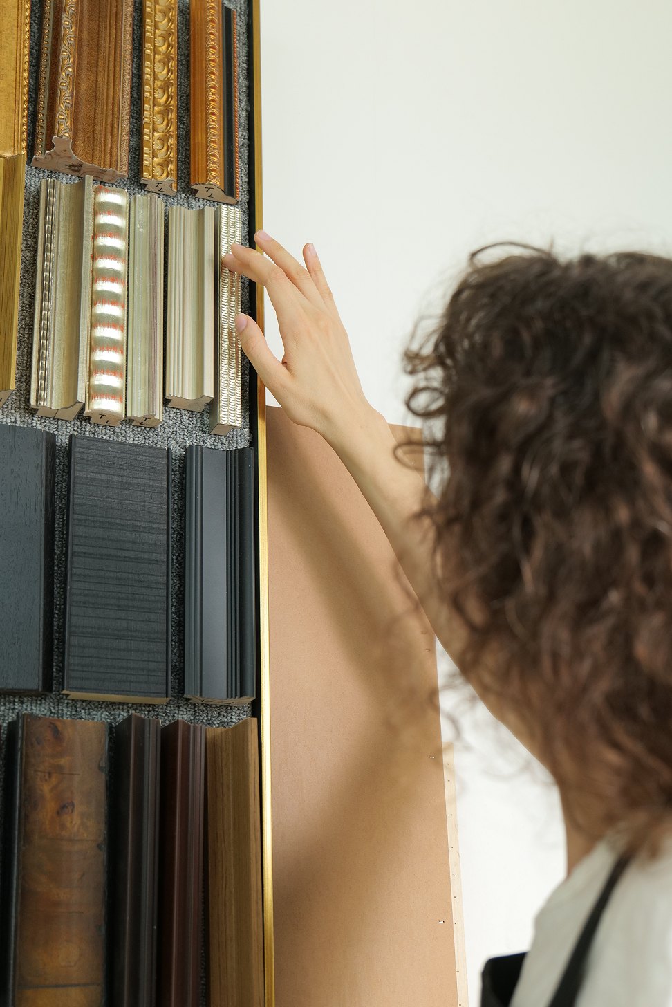 Choosing frame mouldings in the studio